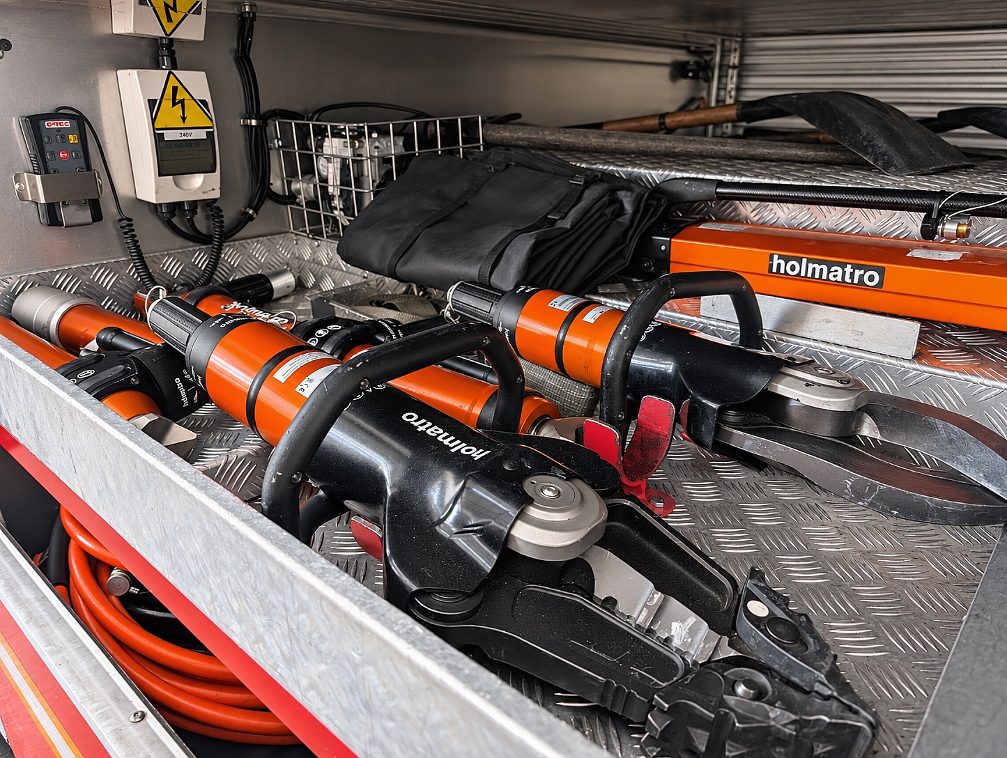 Holmatro hydraulic cutters and spreaders — the heavy RTC gear carried on the MAN Rescue Pump.