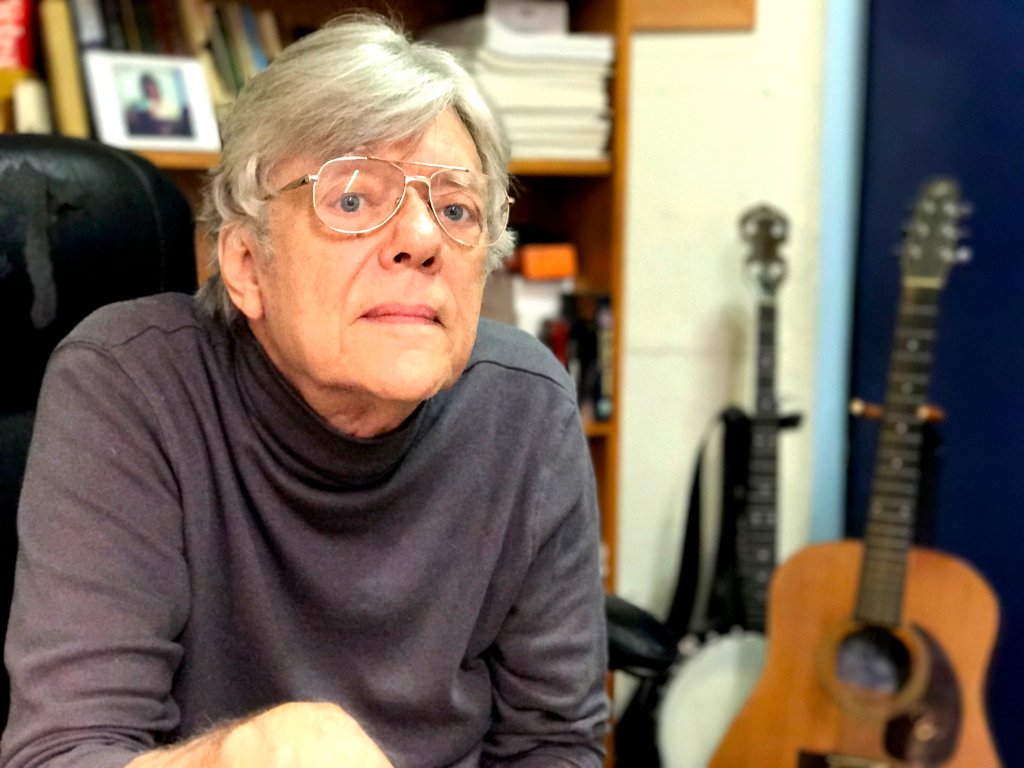 Jack Baker โ guitar and banjo instructor in his Manhattan studio