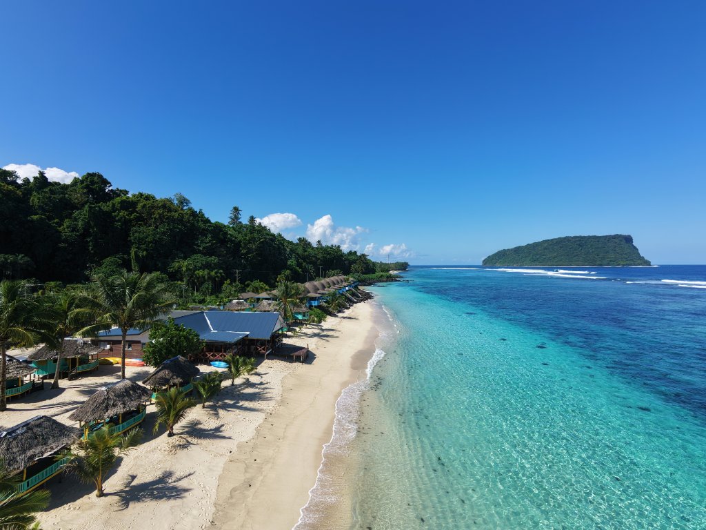 Aerial view of Taufua Beach resort at golden hour