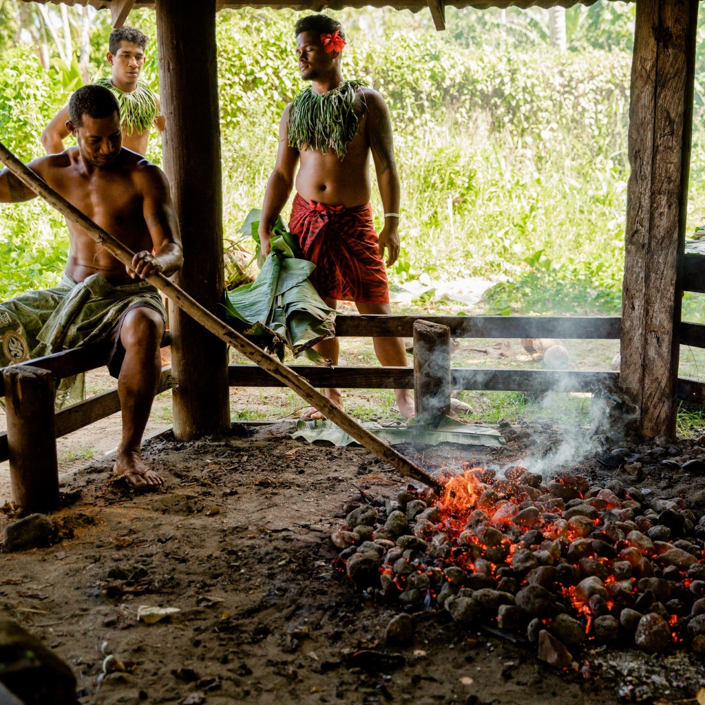 Traditional Samoan cooking over an earth oven