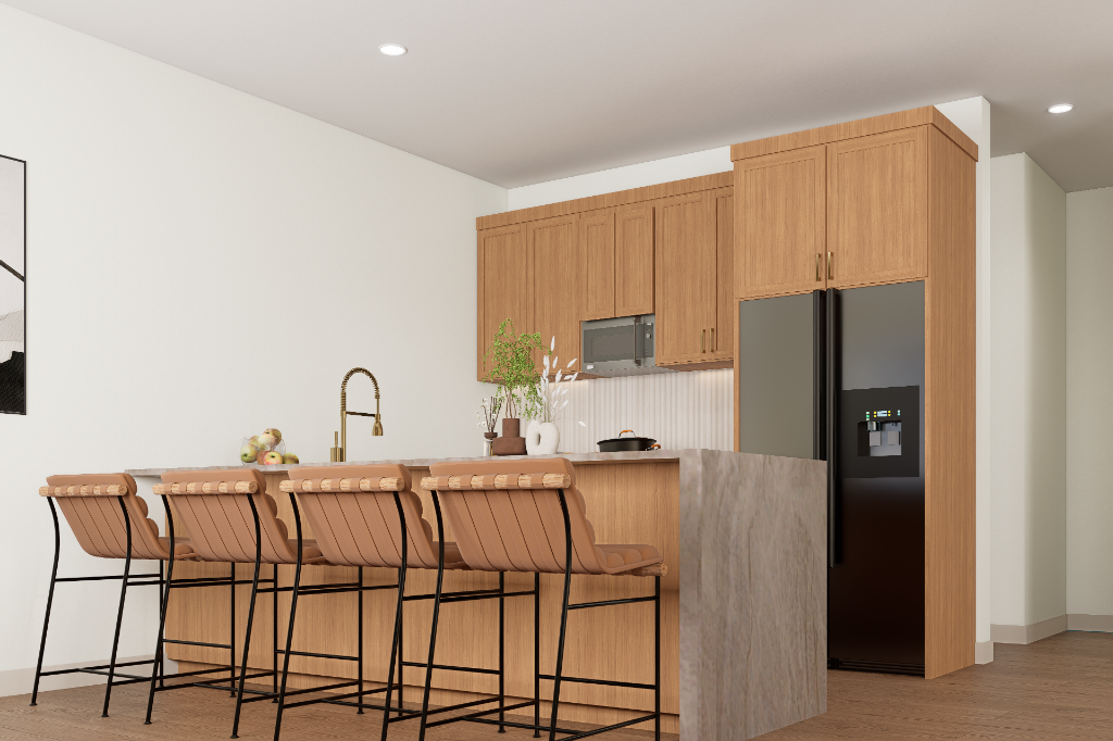 Finished luxury kitchen interior at Brewhouse Lofts — warm wood cabinetry, marble waterfall island, brass faucet, four leather bar stools.