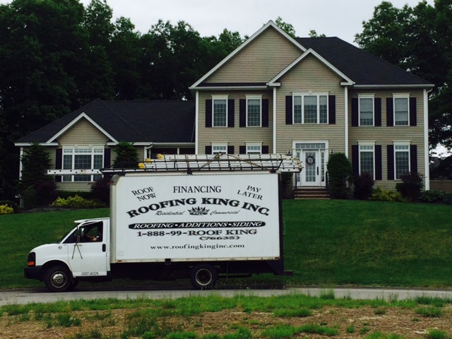 Roofing King truck at a residential job site