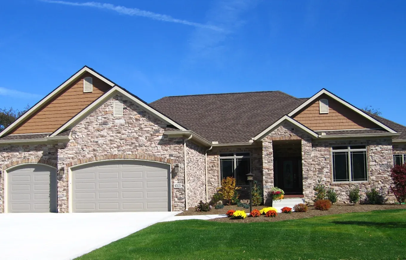 Completed roofing project - stone ranch home