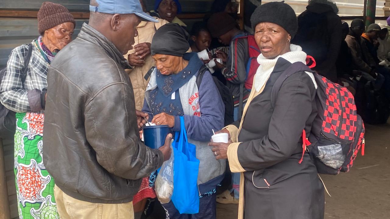 Handing out meals at the outreach