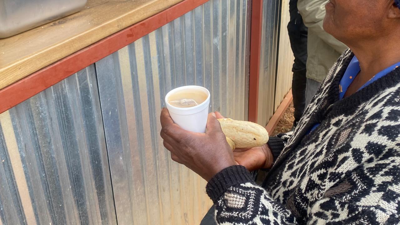Hands receiving a warm meal