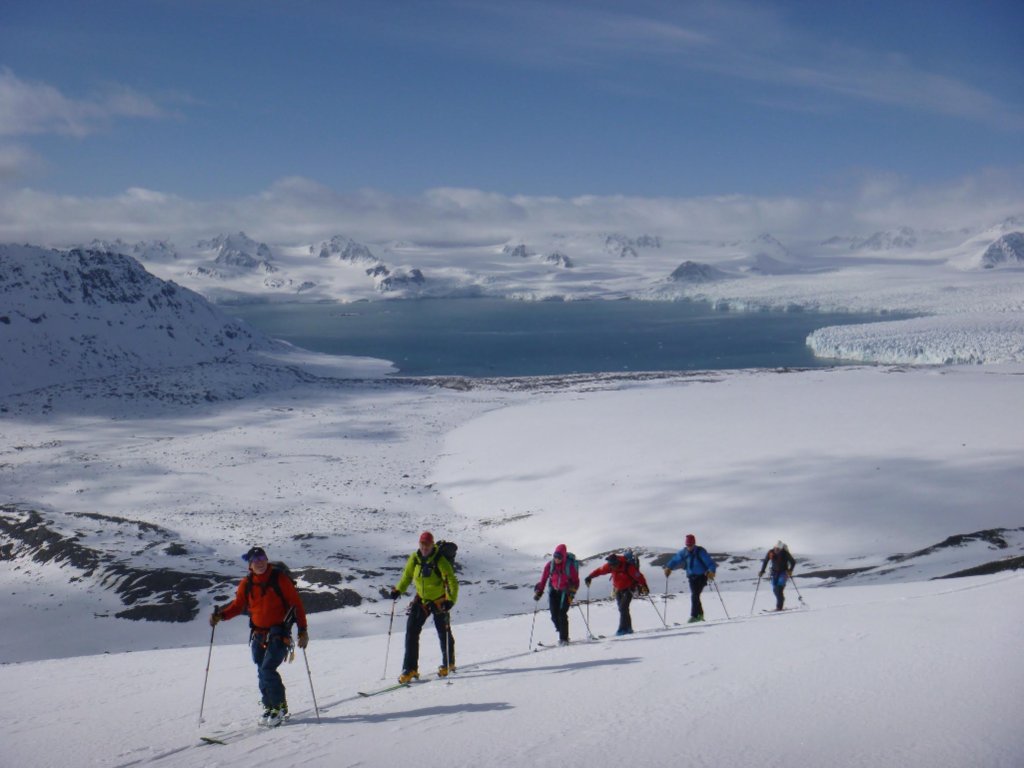 ITCOG guides leading ski touring group through remote Svalbard wilderness