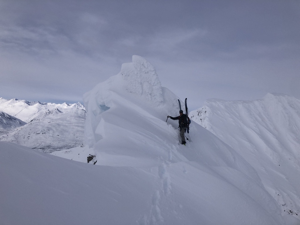 Couloir entrance above Svalbard Arctic sea, guided ski mountaineering expedition
