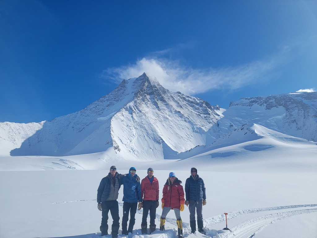 ITCOG guides and clients in front of alpine peak