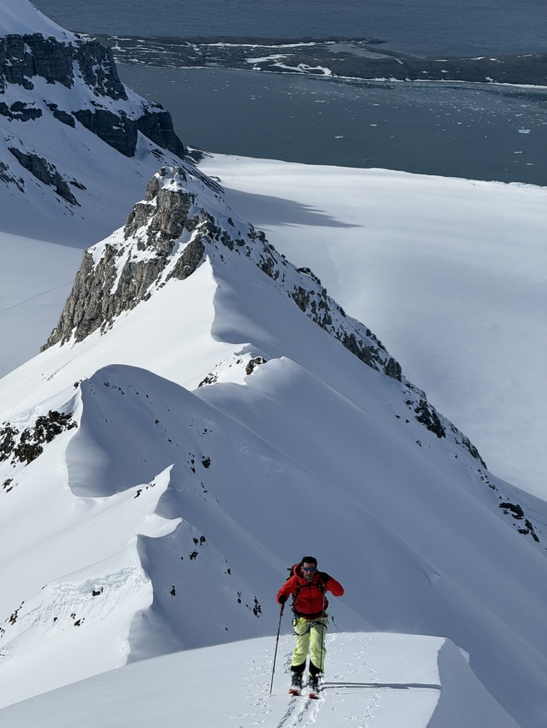 Couloir entrance above Svalbard Arctic sea, guided ski mountaineering expedition