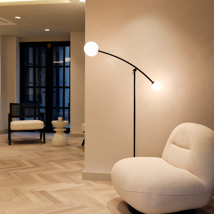 Luminè clinic lounge — warm, welcoming aesthetic medicine environment