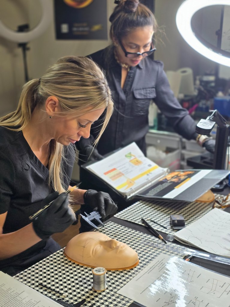 PMU student receiving hands-on training from instructor Raquel Buitizon