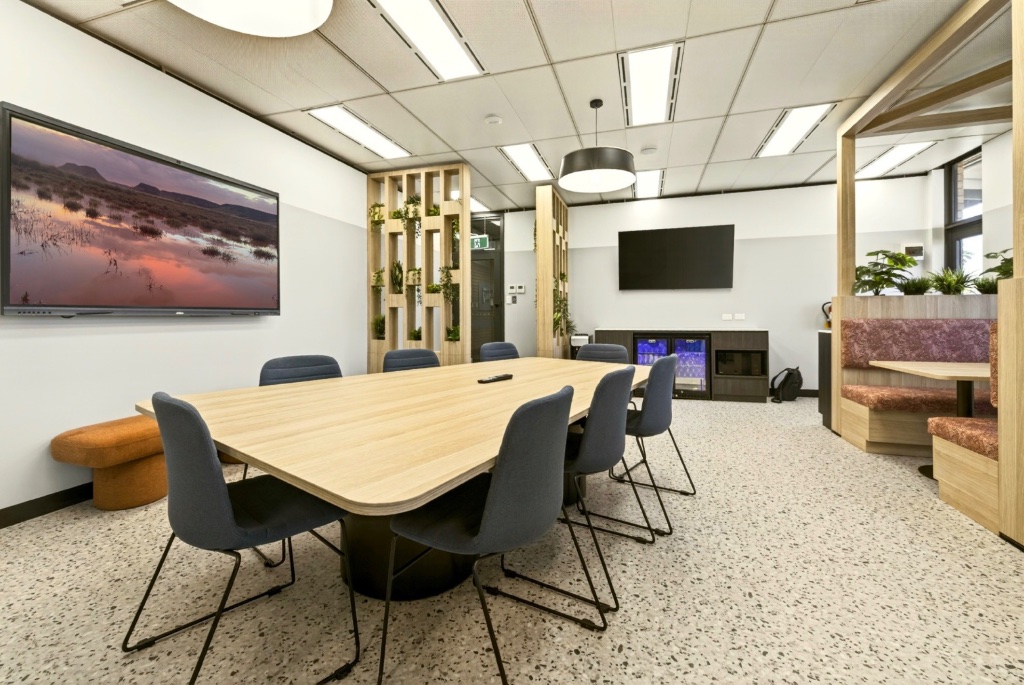 Boardroom with feature wall art and full AV setup