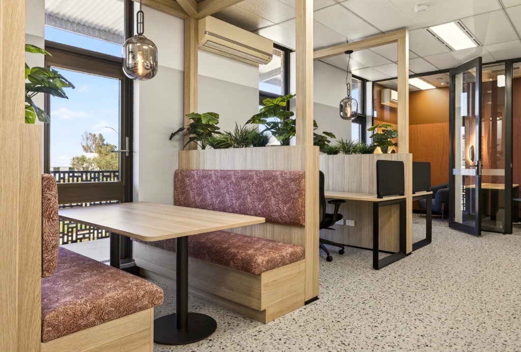 Banquette booth seating — relaxed collaboration with garden outlook