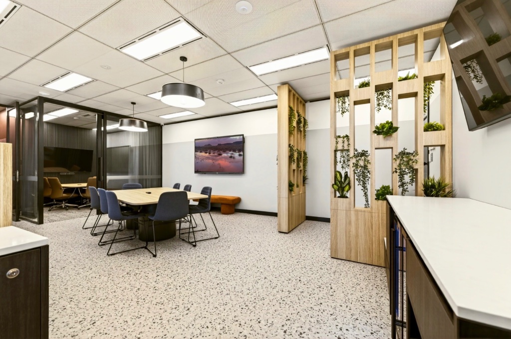 Boardroom overview showing plant divider and adjoining spaces