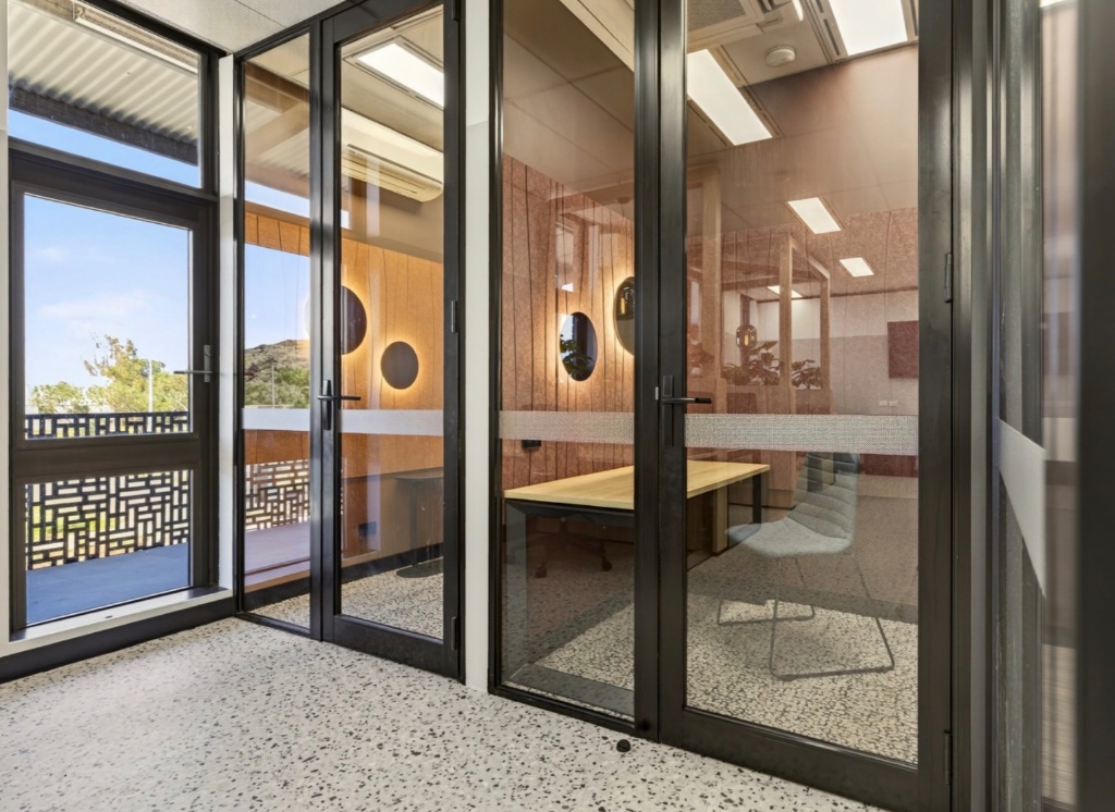Warm-toned private pod — intimate seating with natural light