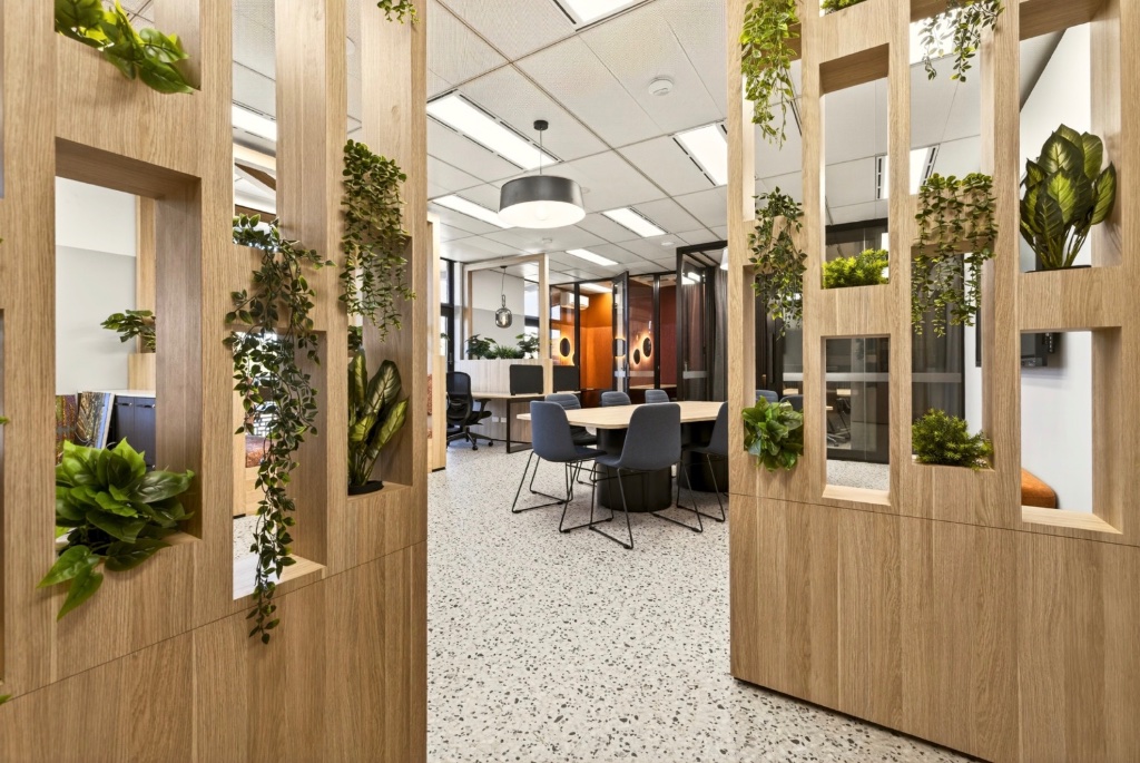 Collaborative boardroom entrance with living green wall feature