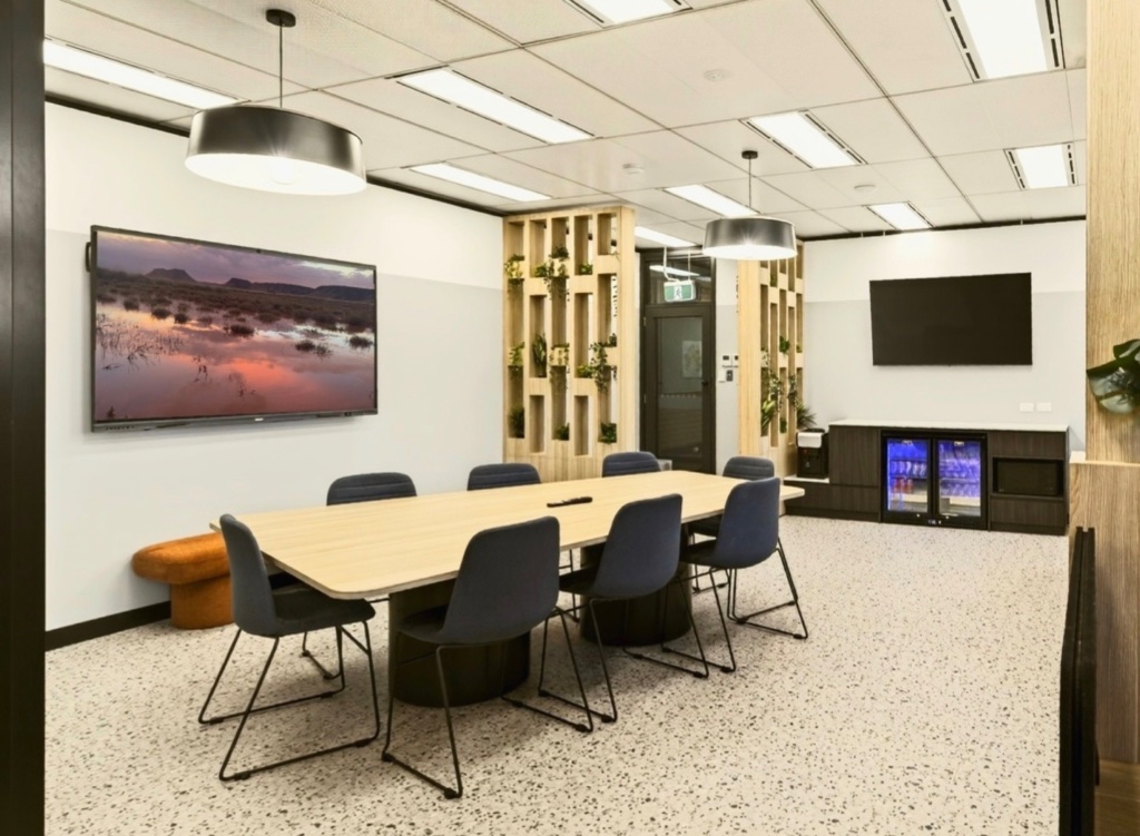 Boardroom side view — bench seating and beverage station access