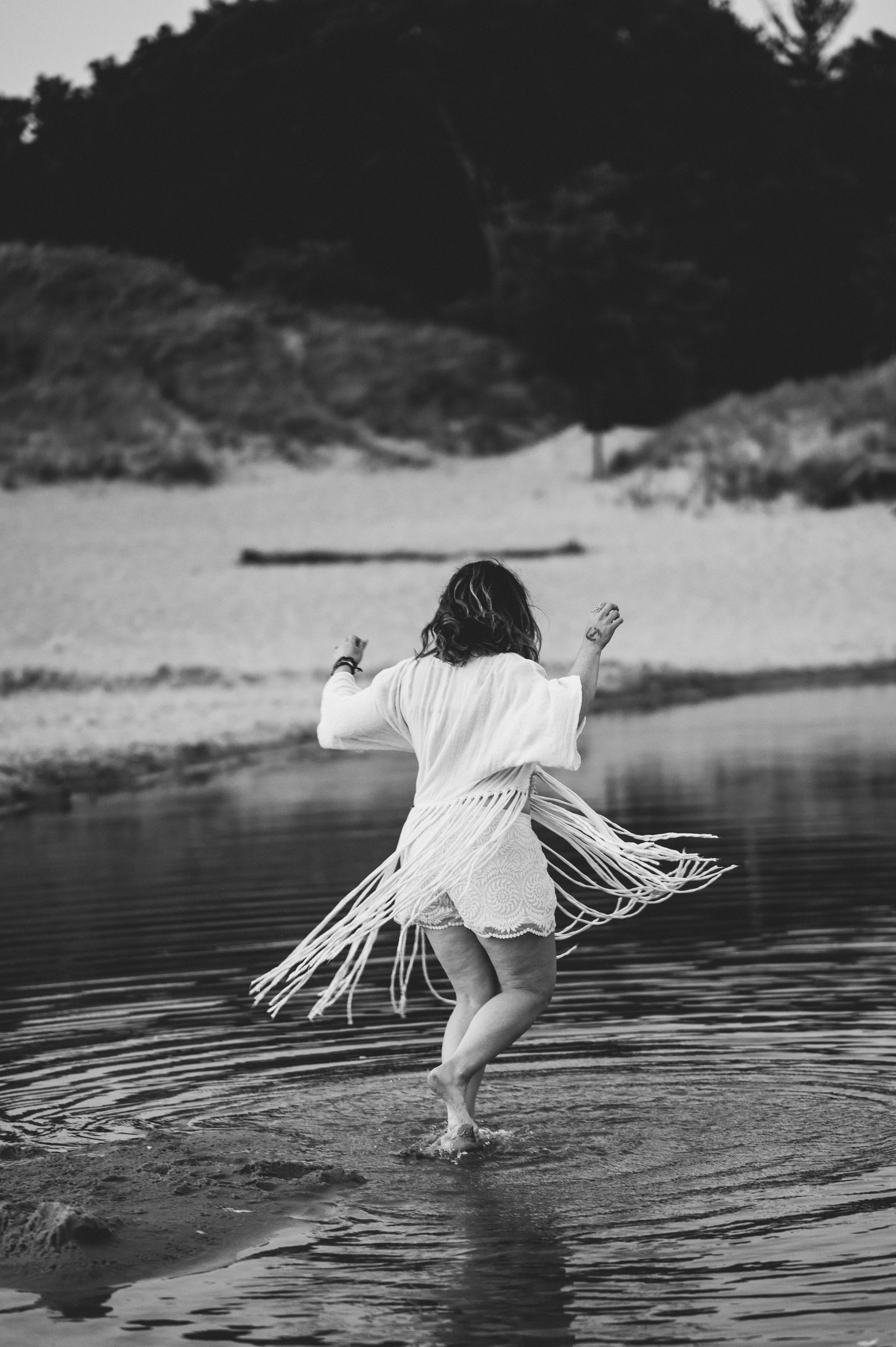 Woman in contemplation by the water