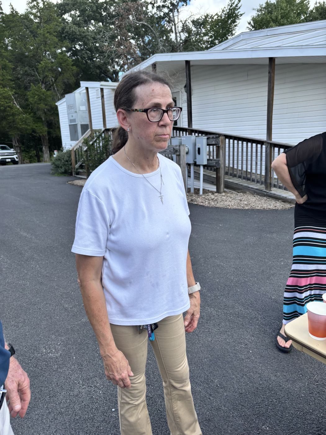 Woman watches the Rally Day games in the parking lot