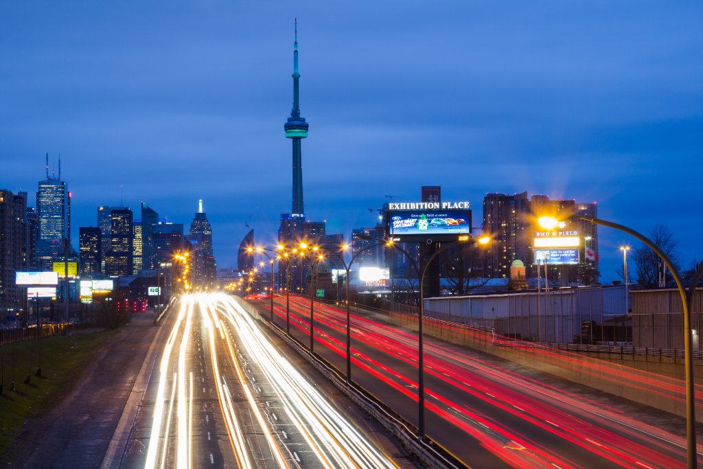 Toronto highway at night with CN Tower