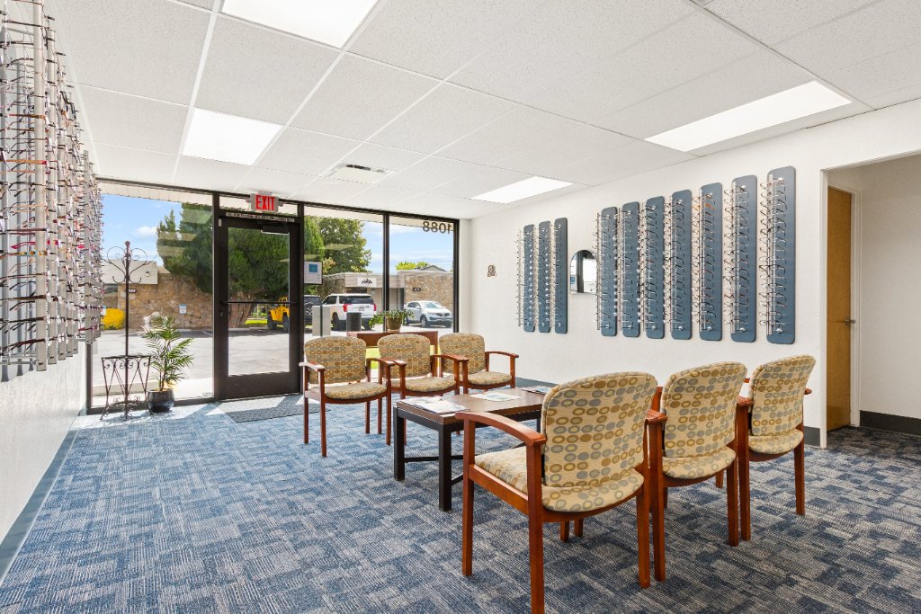 Inside the Lions Vision Center optical store waiting area with eyewear displays