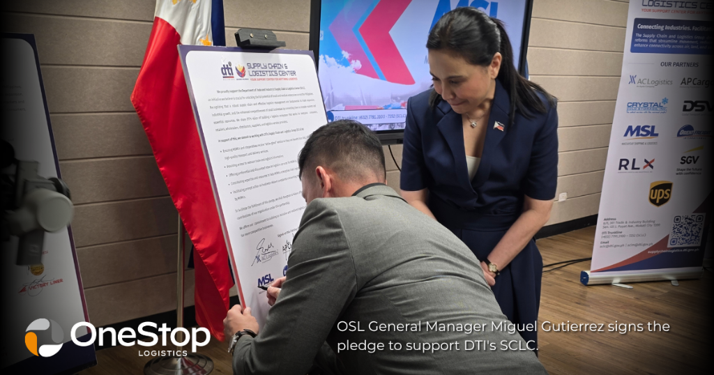 OLSI General Manager Miguel Gutierrez signs the pledge of support