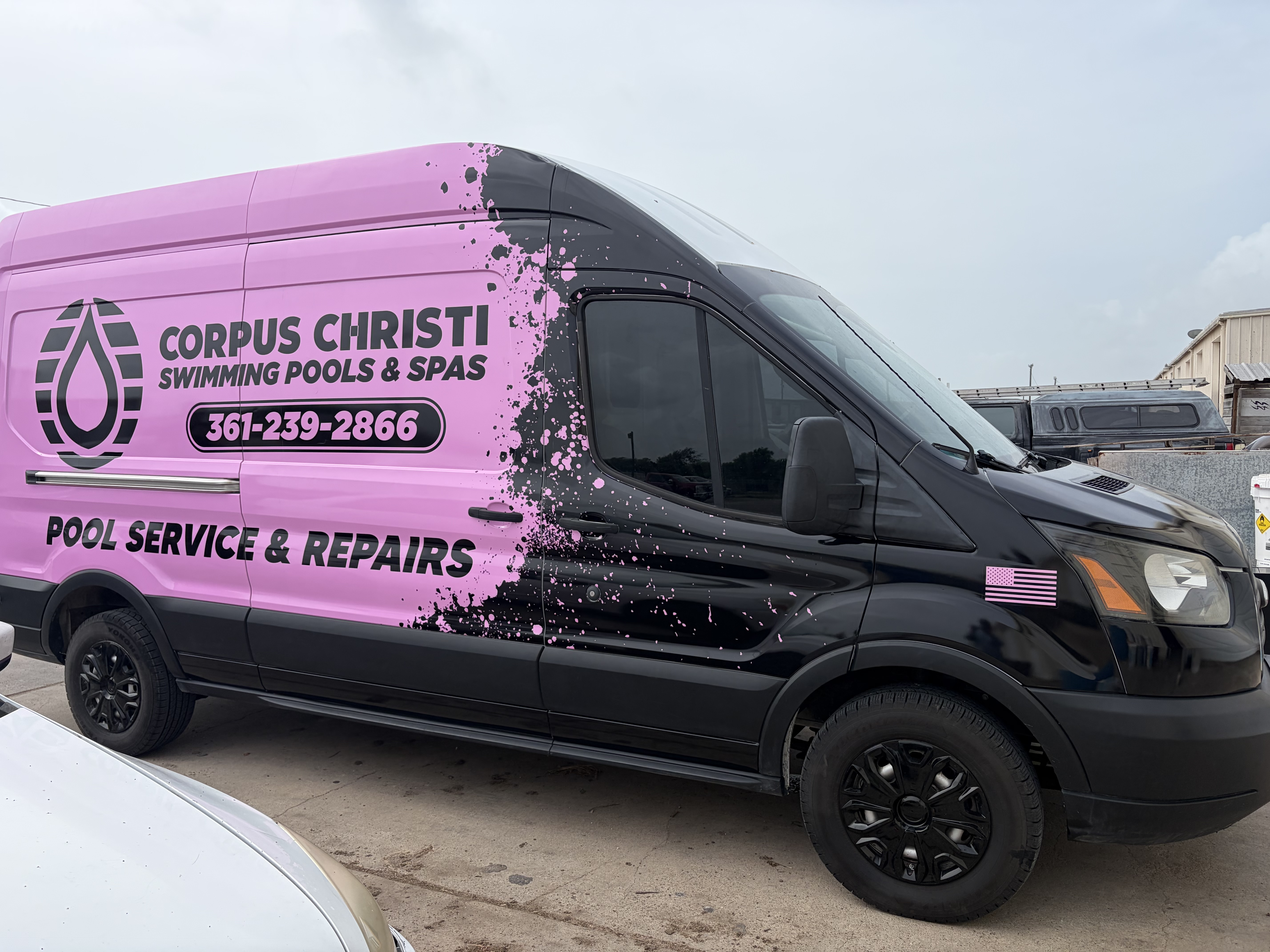 Corpus Christi Swimming Pools & Spas branded pink and black service van parked in Corpus Christi