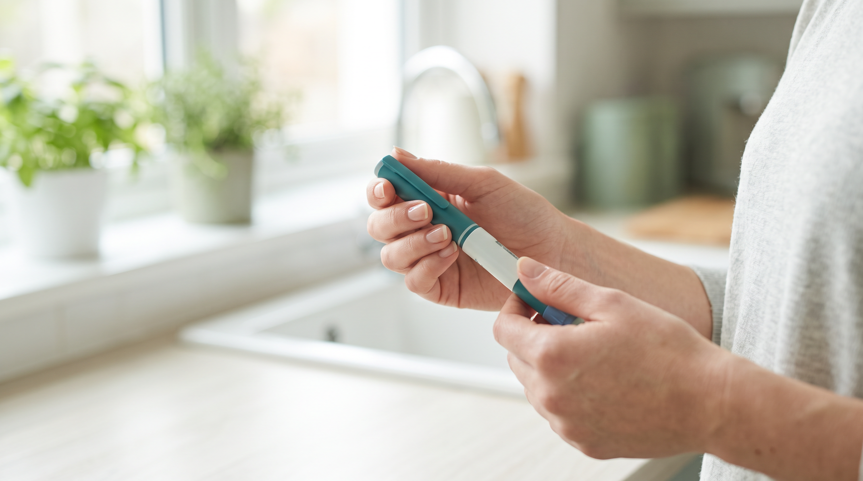 GLP-1 injector pen held in hand