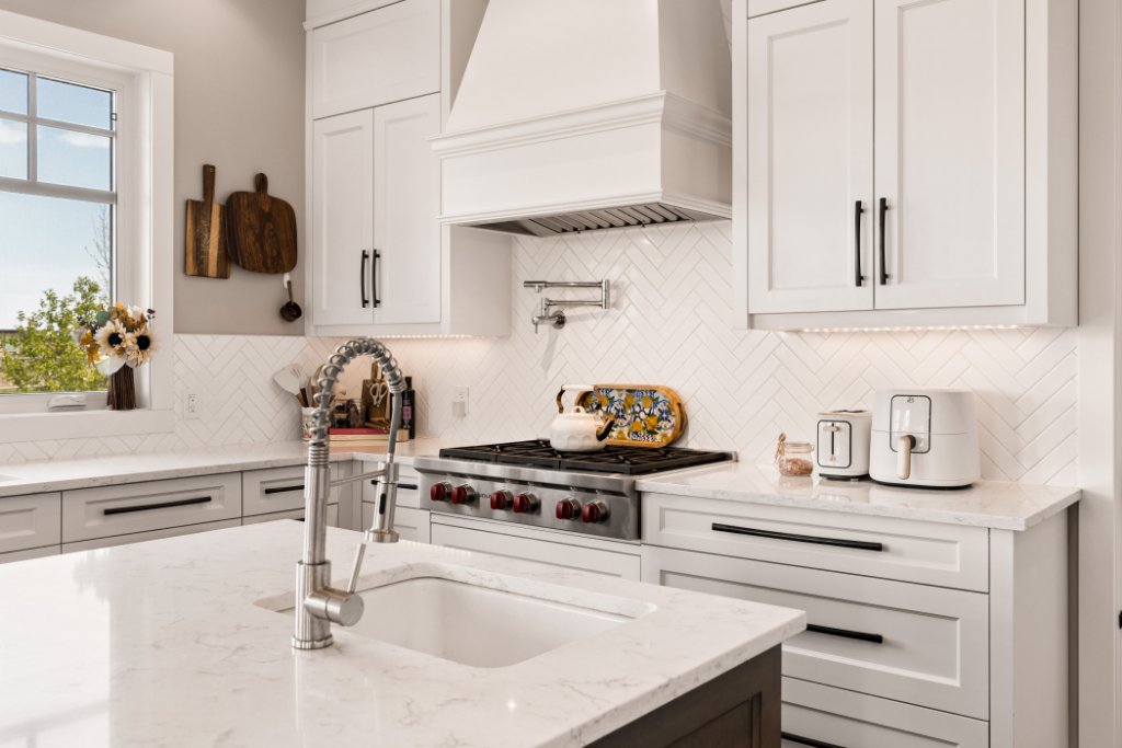 Kitchen detail with custom hood and quartz counters