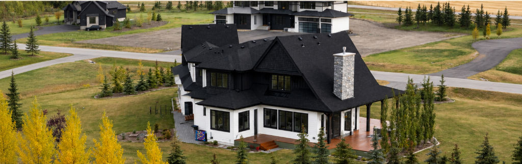 Aerial view of Black Timber Estate — luxury acreage in Bearspaw, Alberta