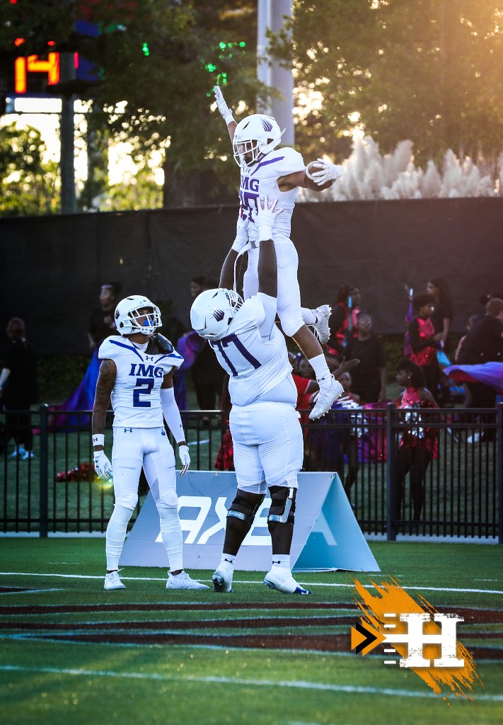 IMG Academy — IMG players celebrate with a lift after a score