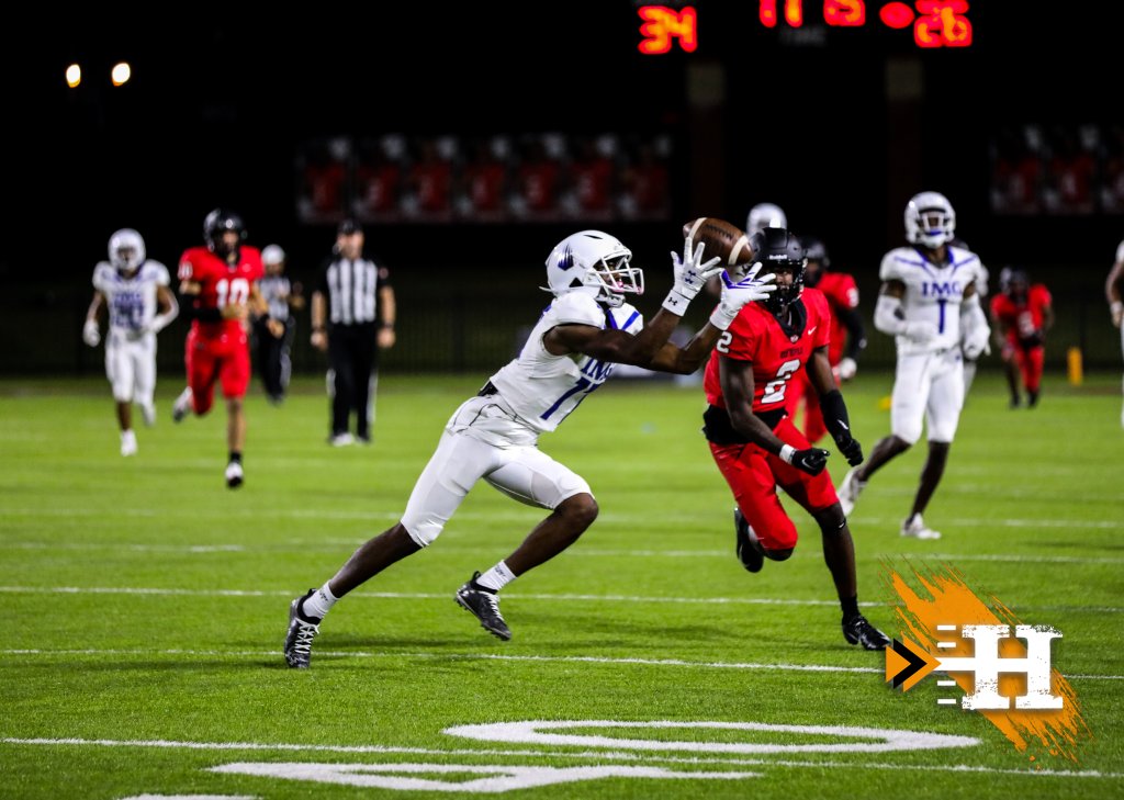 IMG Academy — IMG WR hauls in a catch under the lights