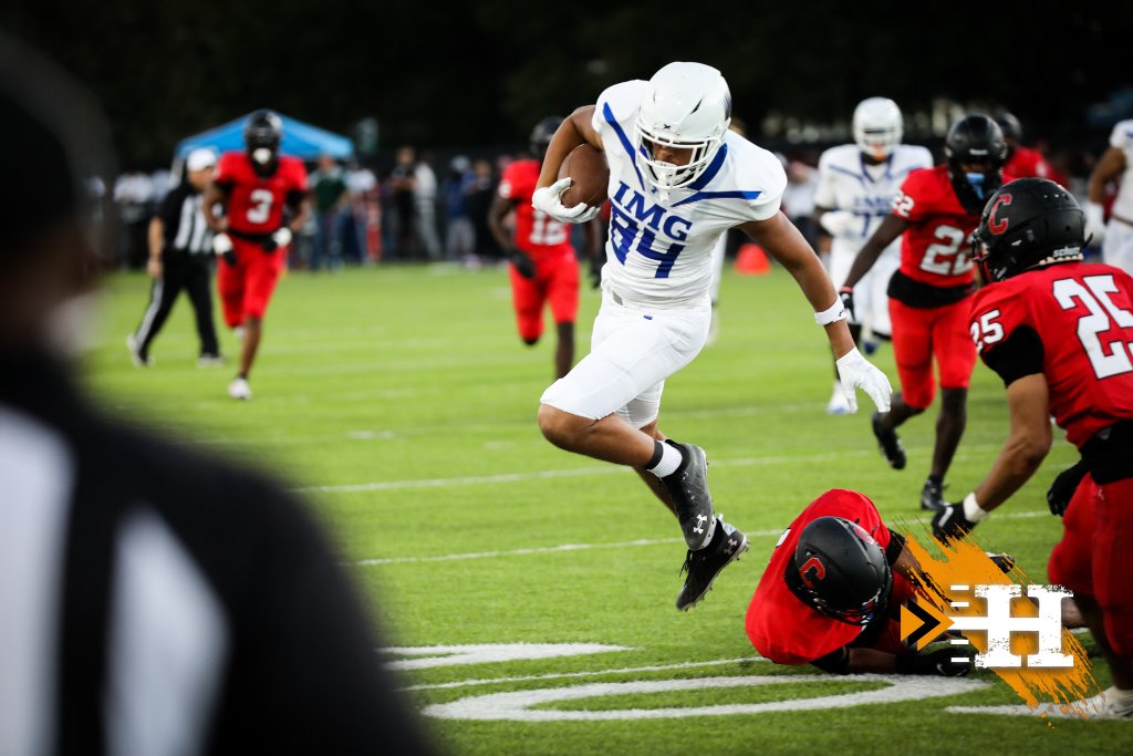 IMG Academy — IMG #34 leaps over a fallen defender