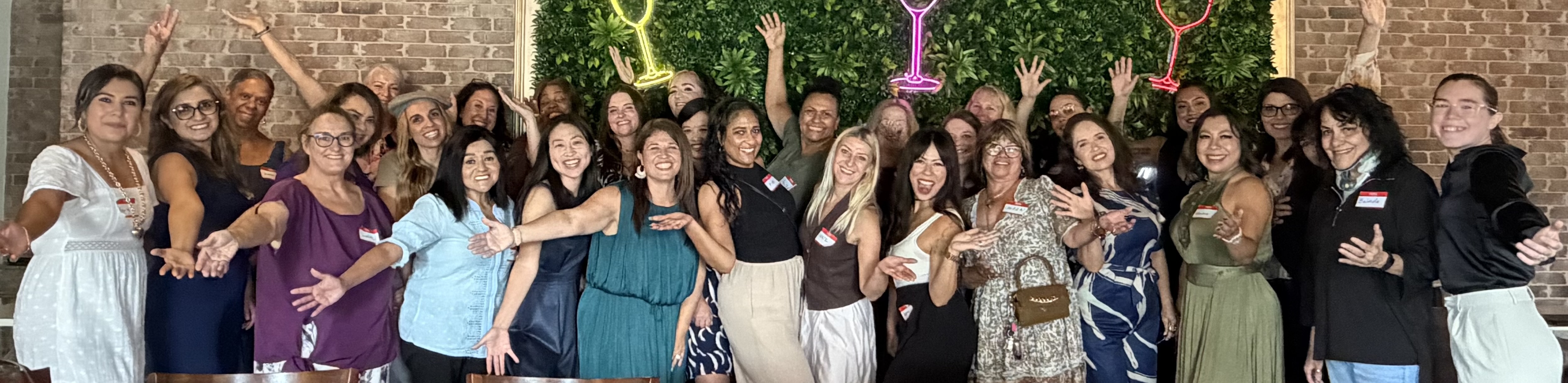 The Moms in the Market community together at an event