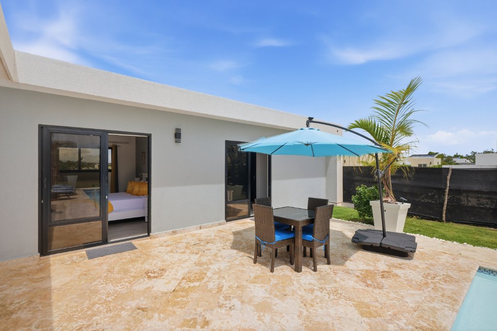 Pool with lounge chairs and umbrella