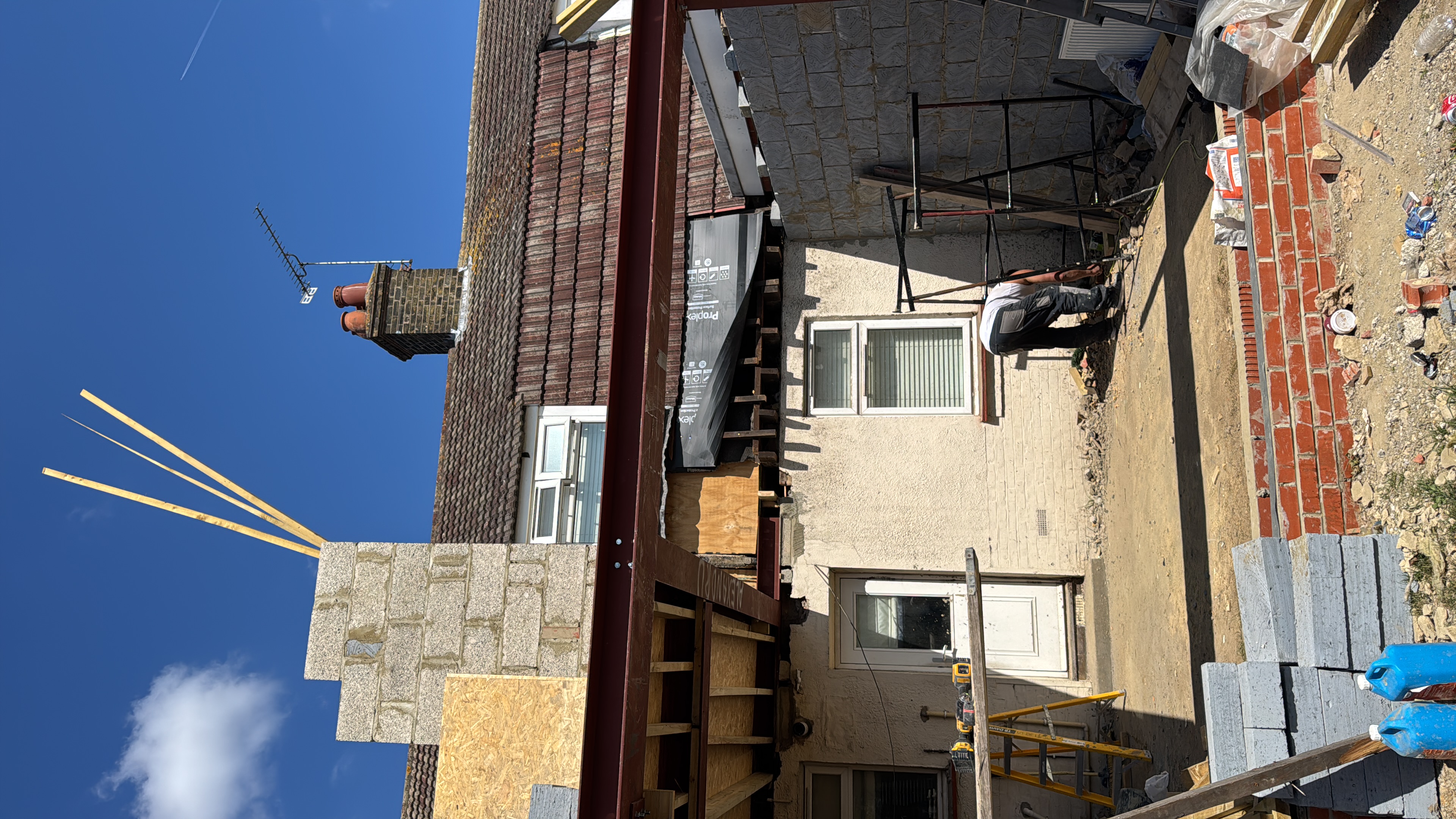Rear extension with structural steel beam being installed