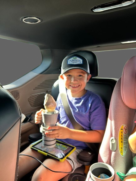 Happy kid using AutoCone in the car