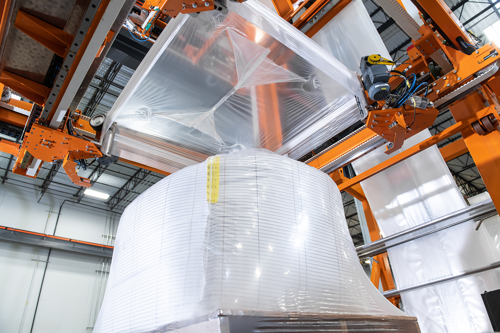 Why Stretch Hood Beats Stretch Wrap for Load Stability - stretch hood machine article