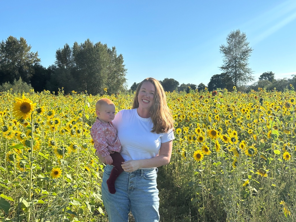 Mother and baby in a sunflower field in Washington State