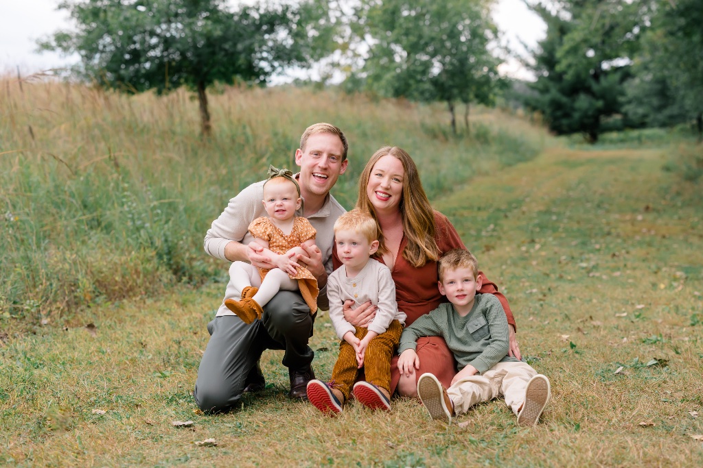 Happy family posing together outdoors