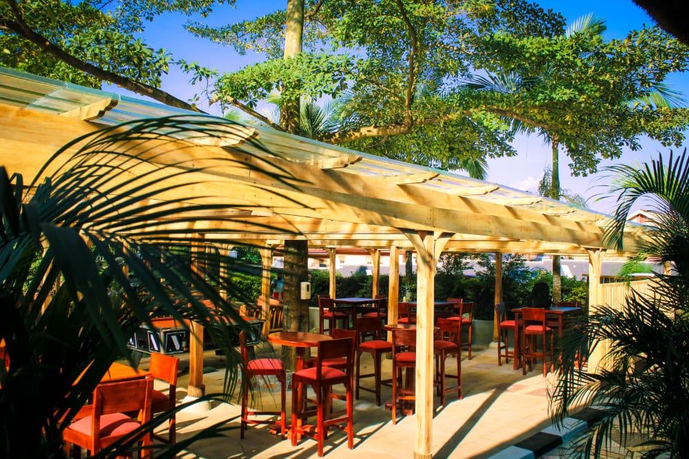 Family dining scene in warm African garden restaurant