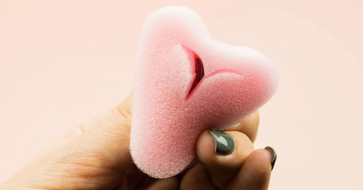 Luxury feminine wellness products on silk