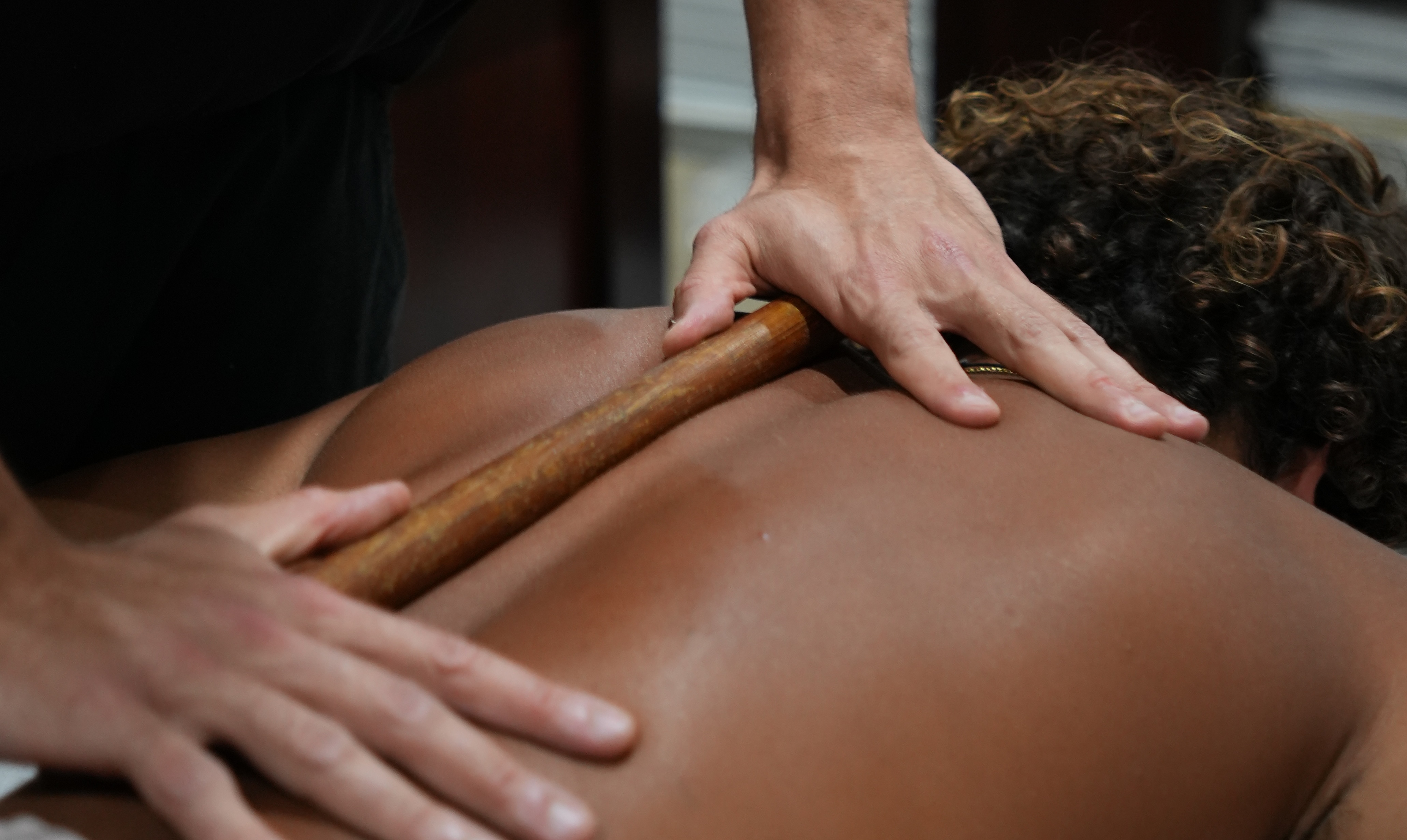 Close-up of SLM bodywork technique using a wooden tool