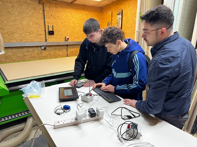 Students installing monitoring hardware