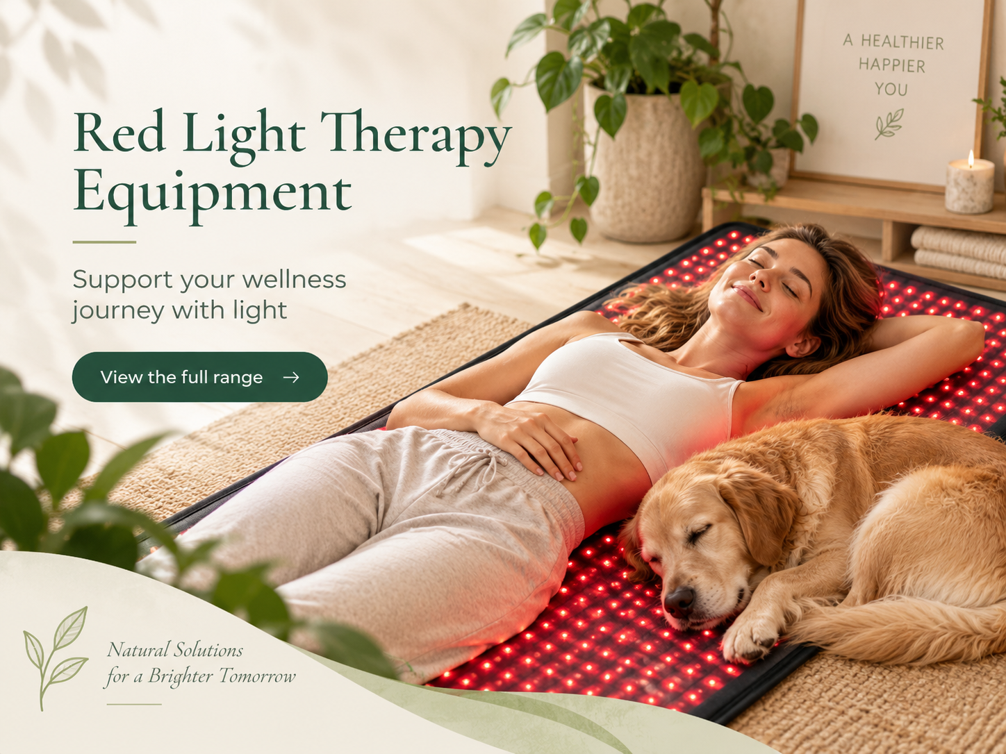 Woman and golden retriever resting on a red light therapy mat