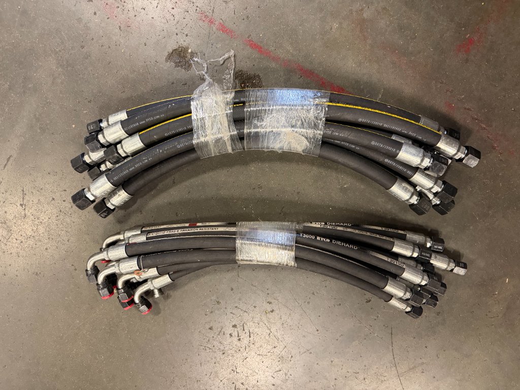 Custom hydraulic hose assembly being crimped