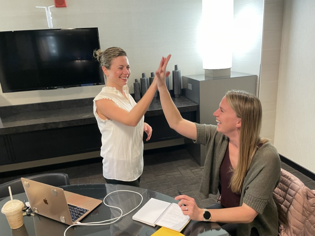 Samantha high five with client