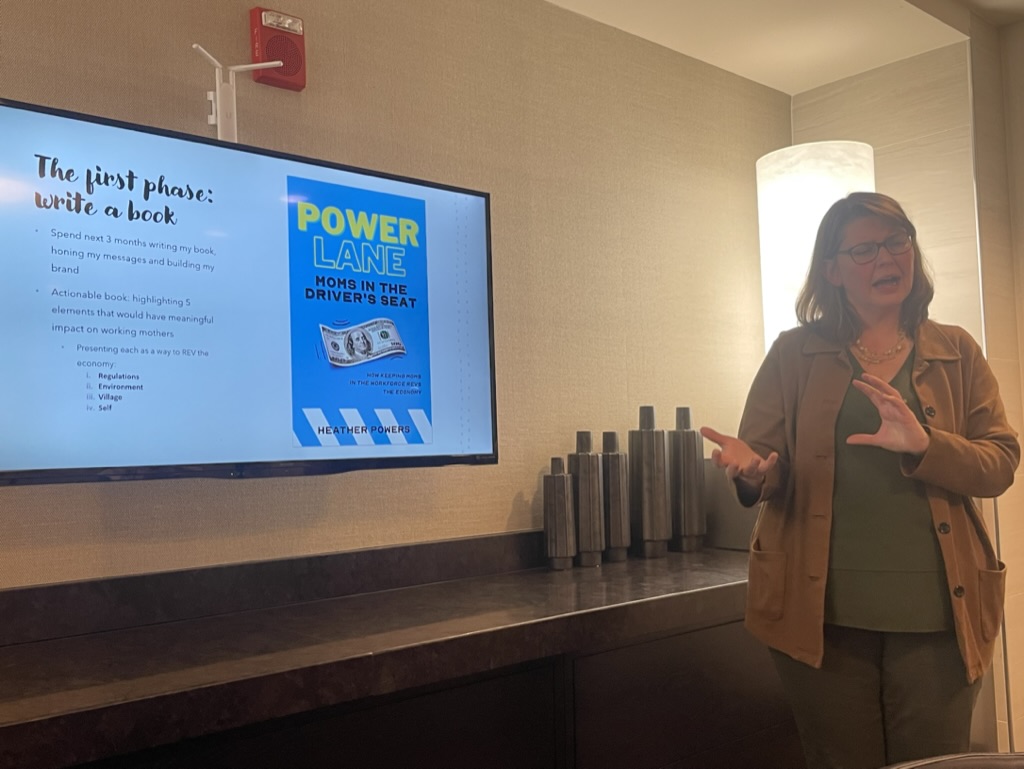 Samantha presenting with feminist leadership book
