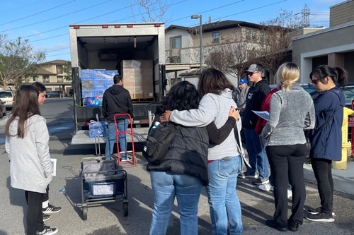 Leah's Pantry community food distribution event in a parking lot