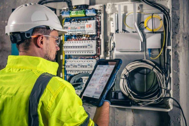 Electrician testing electrical equipment